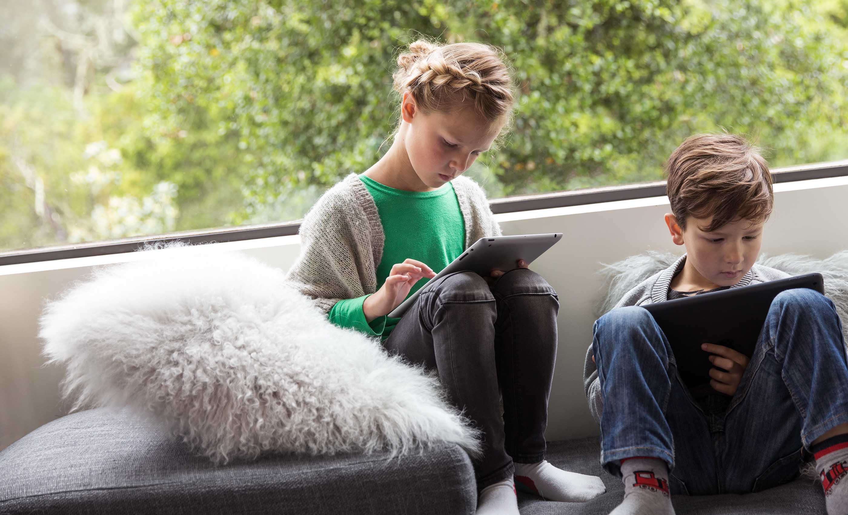 Children using mobile devices - protected by eero Plus